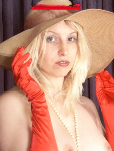 Blonde MILF Sandra Blow gets naked in a floppy hat and opera gloves