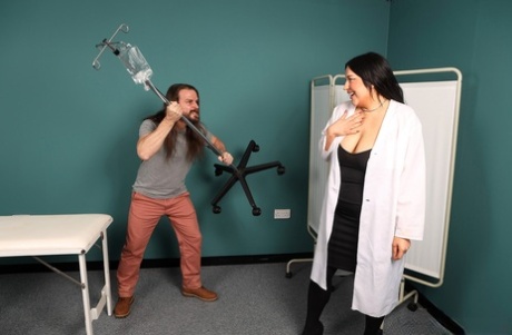 British women in lab coats subdue a patient with a bout of CFNM sex