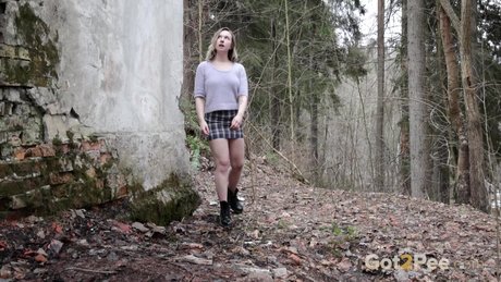 Beautiful girl Alice Klay takes a badly needed pee at an abandoned building