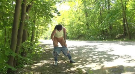 Brunette MILF Ali Bordeaux pulls down ripped jeans to piss next to a road