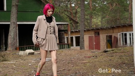 Vasya pulls down her panties while taking an outdoor piss in a miniskirt