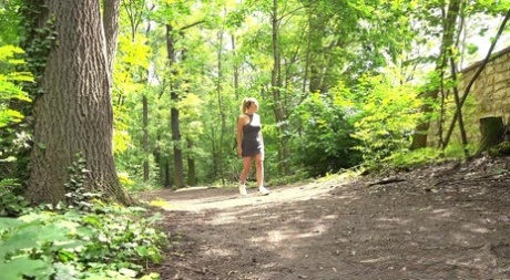 Hot girl Naomi Benet gets caught taking a piss on a path in the woods