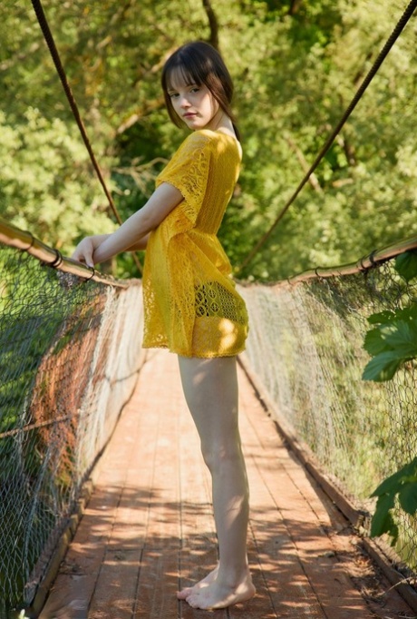 Charming teen Dakota gets totally naked on a pedestrian bridge