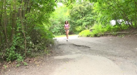 Caucasian chick Ali Star takes a badly needed pee while walking on a road