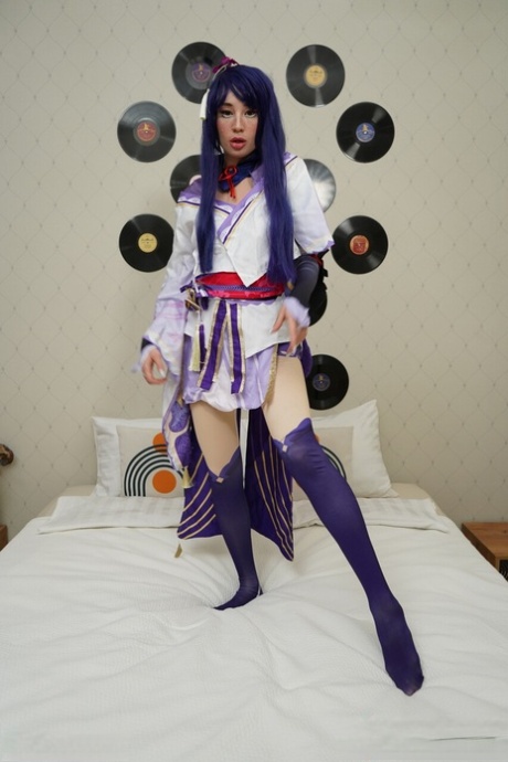 Cute Asian cosplayer Pretty Mary partakes in a hard fuck on a bed