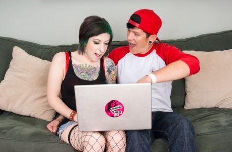 Tattooed girl Miss Genocide and her boyfriend watch XXX action before fucking