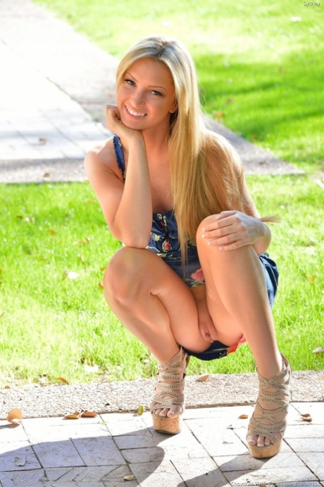 Hot blonde with long teen girl legs flashing no underwear upskirt outside
