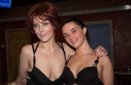 Brunette teen Pixiee Little and a redhead take part in a bukkake scene