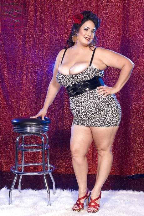 Curvy brunette Rikki Waters flashing fat tits and plump ass in sexy mini dress