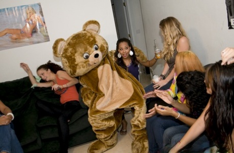 Clothed babes have their mouths fucked hard by a dancing bear on a party