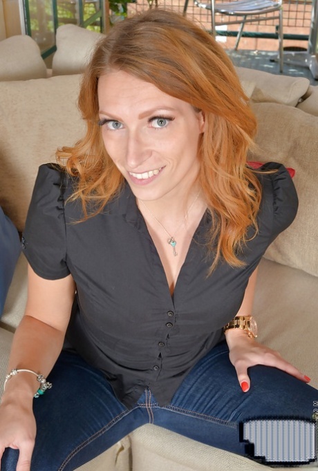 Mature redhead woman Ava Austen undresses pretty sexy and hot