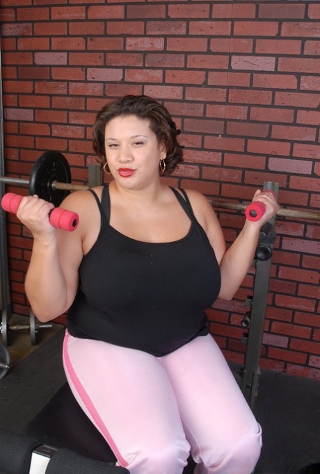 Older busty BBW Monet finishes her workout by undressing in the gym