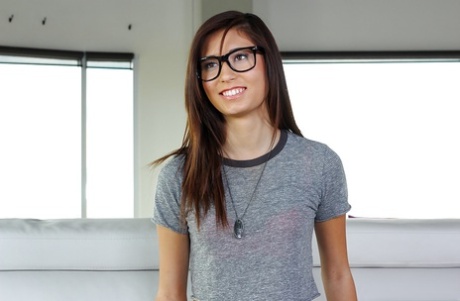 Nerdy chick Kimberly Costa posing non nude in spandex pants and glasses