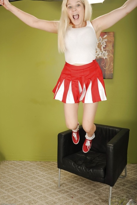 Chesty young blonde cheerleader Prudence Pond flashing upskirt panties