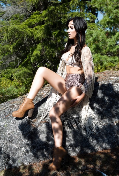 Brunette centerfold babe Alyssa Bennett unveils big tits outdoors