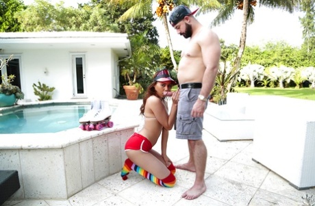 Long socks adorned Latina Jade Dylan giving ball licking BJ outside by pool
