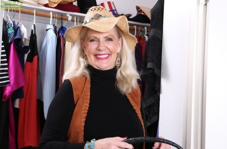 Chubby aged blonde Judy Belkins unveiling big mature tits in straw hat