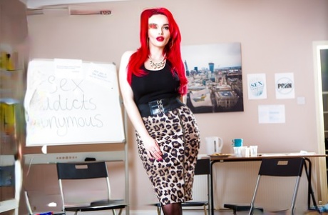 Redhead Jasmine James loosing big butt from cougar print skirt in office