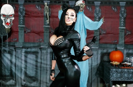 Brunette beauty Audrey Bitoni posing in cat woman garb and makeup