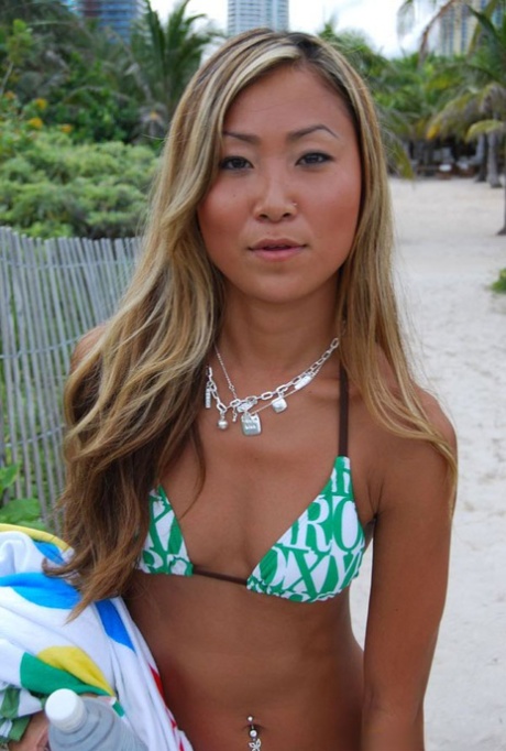 Asian teen babe with tiny tits Tina posing in hot bikini outdoor