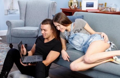 Teen girl with perky tits seduces her gaming boyfriend on a sofa