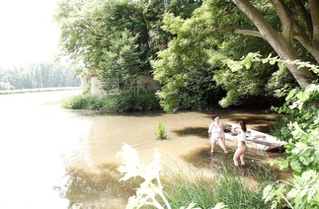 Shione and her busty lesbian friend toying each other by the river