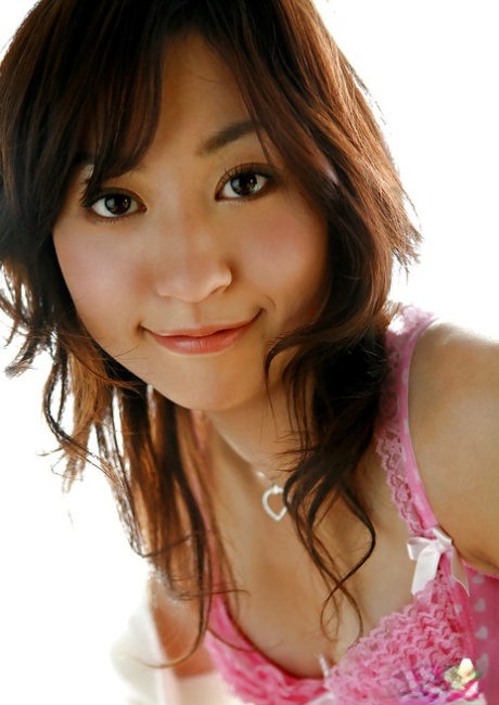 Sweet asian babe Momo Yoshizawa slipping off her pink lingerie