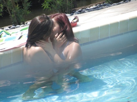 Hot sweeties get caught on voyeur video having some lesbian fun outdoor