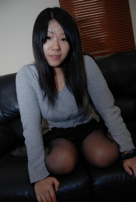 Asian teen Natsuki Arai striping down and spreading her lower lips