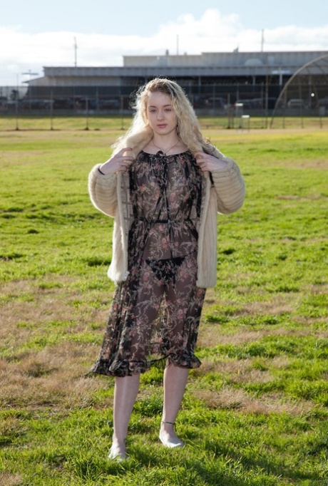 Teen Veronica Hatley flashes her panties while posing in her sheer dress