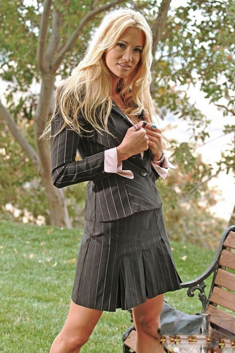 Sexy Jessica Drake sheds her skirt & poses in only her suit jacket at the park