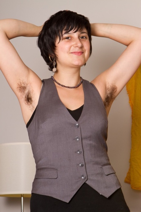 Dirty chick with big tits Sarah S lifts her arms up and shows hairy armpits