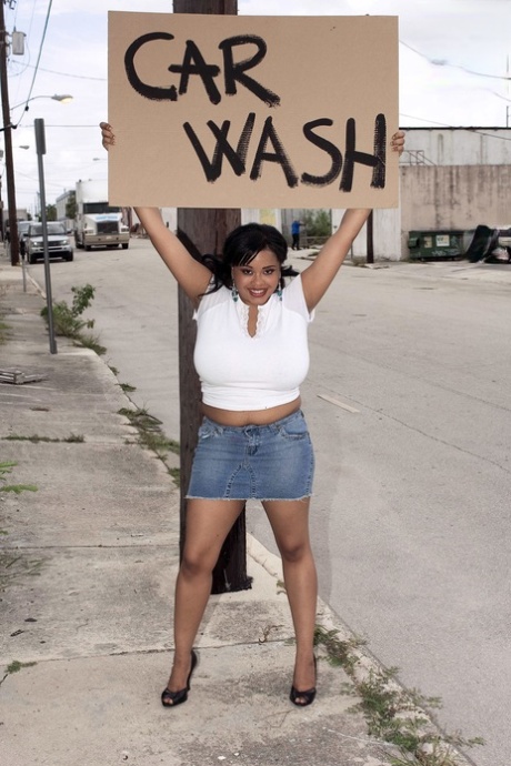 Black BBW Sunny Dee soaps up her massive boobs while running a car wash