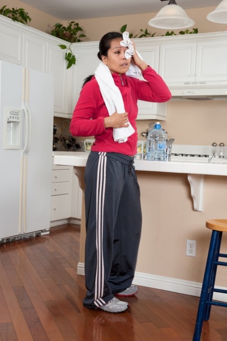 Exotic Asian broad Max Makita showing off her bush in the kitchen