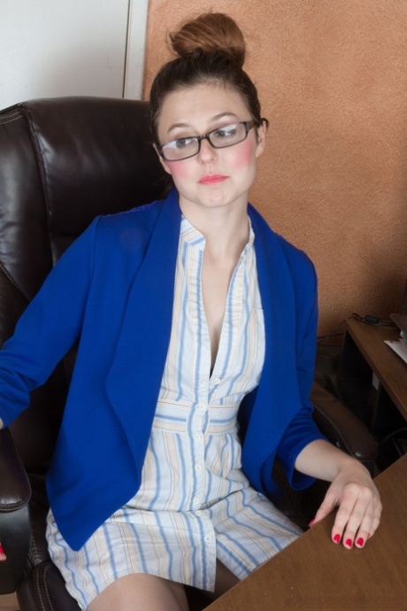 Small breasted secretary in glasses disrobes to stretch hairy ass at her desk