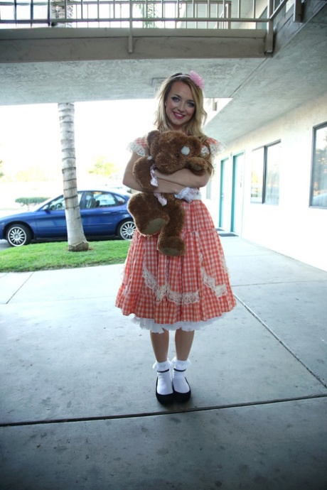 Young blonde girl Carmen Callaway poses non nude with a plush toy