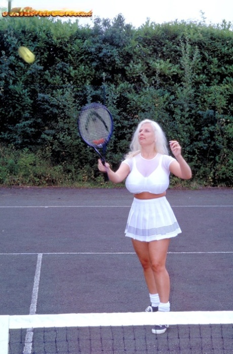 German female Julia Miles exposes her hooters while playing tennis