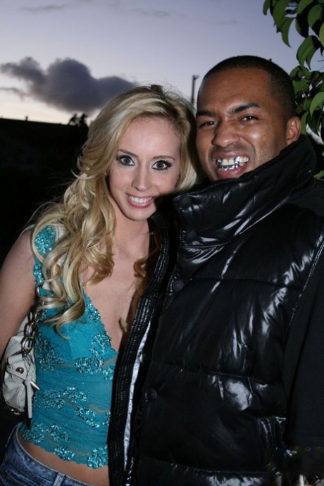 Blonde girl Kelly Wells meets a black man in the street and shows off her butt