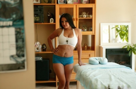 Latina MILF Sophia Lomeli slowly undresses and unveils her fake melons