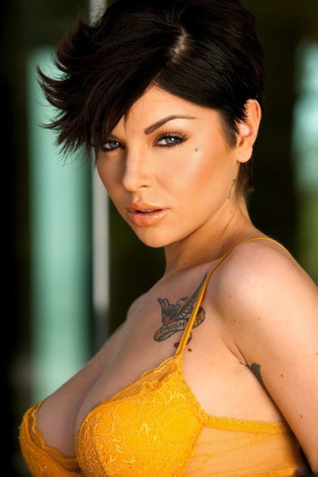 Short haired babe Jai Bella reveals her sexy tattooed naked body
