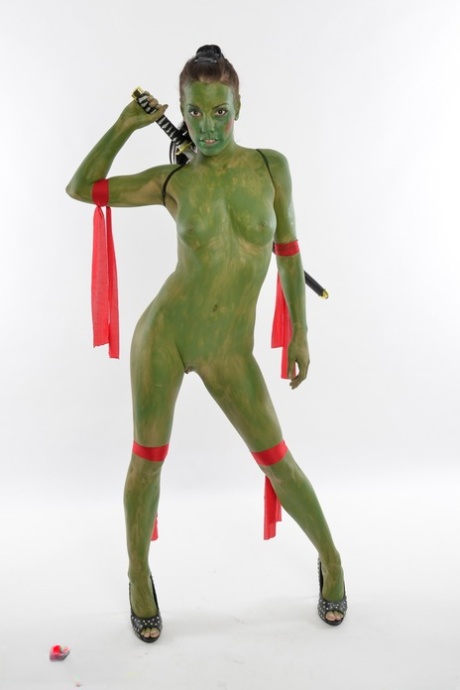 Solo model Shana Lane poses naked in her Green Samurai costume