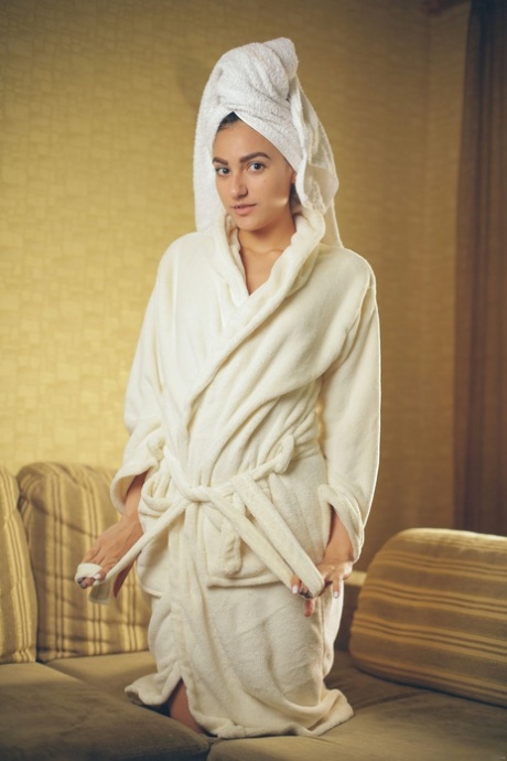 Brunette Russian Cira Nerri takes  robe off for naked photo shoot in bath