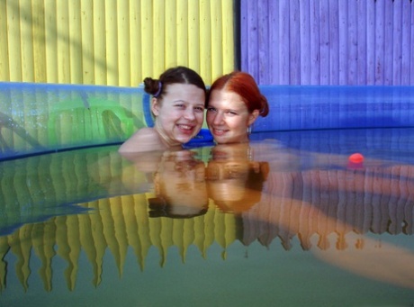 Barely legal girls Britt E and Anita E play with their pussies underwater