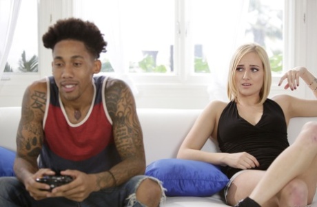 Blonde chick Kate England seduces a black stud while he plays video games