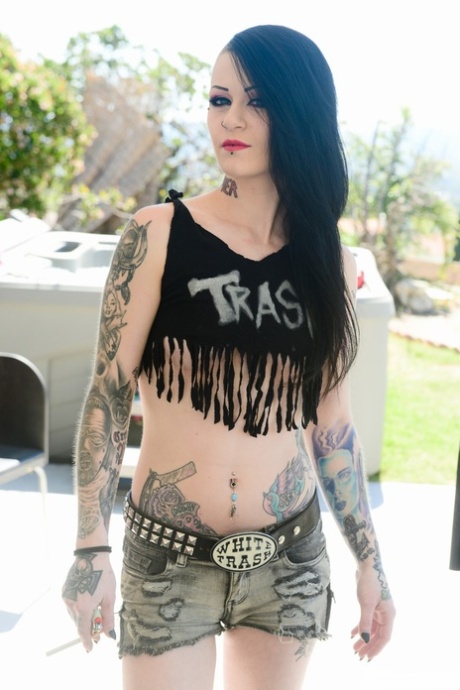 Trashy goth Mallory Maneater peels naked in the sunshine to beg for anal