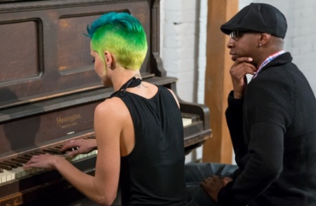 Green haired punk girl pianist makes music on her teacher