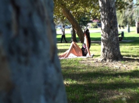 Kinky voyeur catches hot brunette Allison Tyler hiking her dress in the park