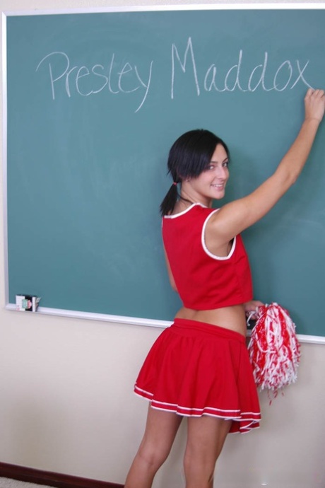 Brunette cheerleader Presley Maddox shows her natural tits at school