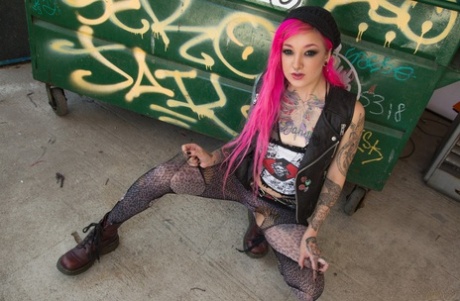 Smoking pink haired Kelsi Lynn shows petite ass & pussy beside the dumpster