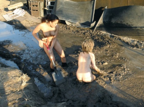Blonde MILF Tyla Wynn endures a 2 against 1 naked lezdom session in the mud